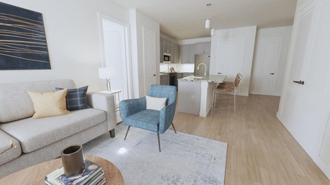 a living room and kitchen with a couch and chairs